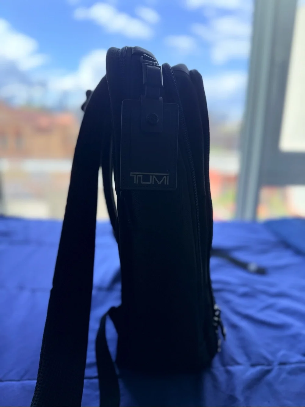 Tumi Black Bag with Red Limited-Edition Tag